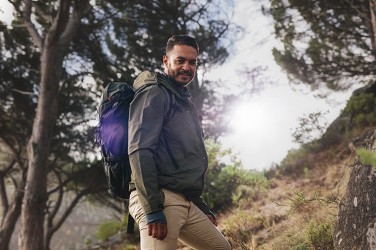 Handsome young man hiking in nature