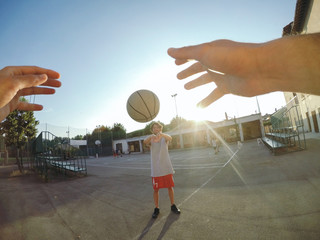 Point of view image of man throwing basketball at teammate
