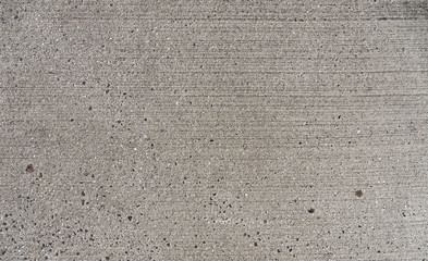 Grauer Beton mit kleinen Steinchen