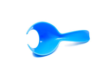 Modern plastic egg spoon isolated