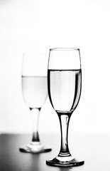 monochrome photo of champagne on white table on white background isolate