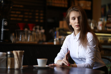 The girl in the cafe breakfast