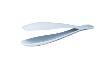 Grey plastic kitchen tongs isolated