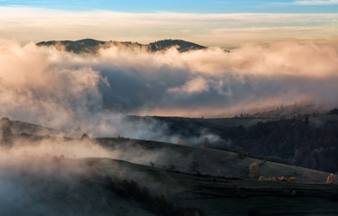 clouds and fog rising over countryside