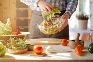 male cooking healthy salad