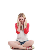 full length portrait of a blonde girl wearing casual t-shirt and denim shorts. isolated on white...
