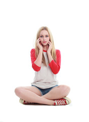 full length portrait of a blonde girl wearing casual t-shirt and denim shorts. isolated on white...