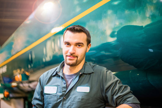 Portrait of young male trucker at biofuel industrial plant
