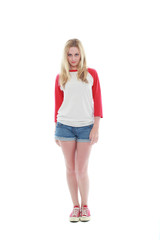 full length portrait of a blonde girl wearing casual t-shirt and denim shorts. isolated on white background.