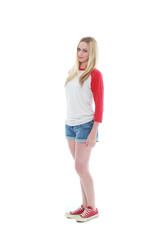Fototapeta premium full length portrait of a blonde girl wearing casual t-shirt and denim shorts. isolated on white background.