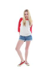 Fototapeta premium full length portrait of a blonde girl wearing casual t-shirt and denim shorts. isolated on white background.