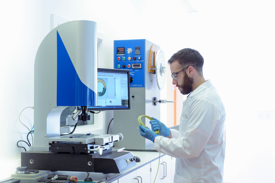 Scientist Testing Electrical Cable In Electrical Cable Laboratory