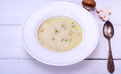 Mushroom soup in a white round plate