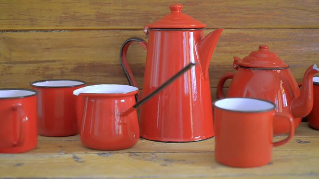 Red enameled cups and teapot