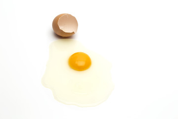 Broken egg on white background