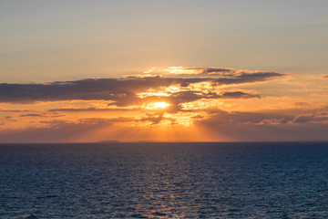 Sunlight breaks trough some clouds. Beautiful colors.