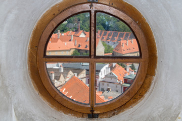 View of through the round window of the historic center of Cesky Krumlov