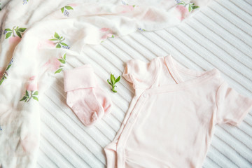 Baby girl clothes. Fabric background.