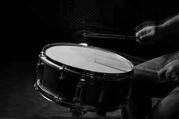 The man is playing snare drum.