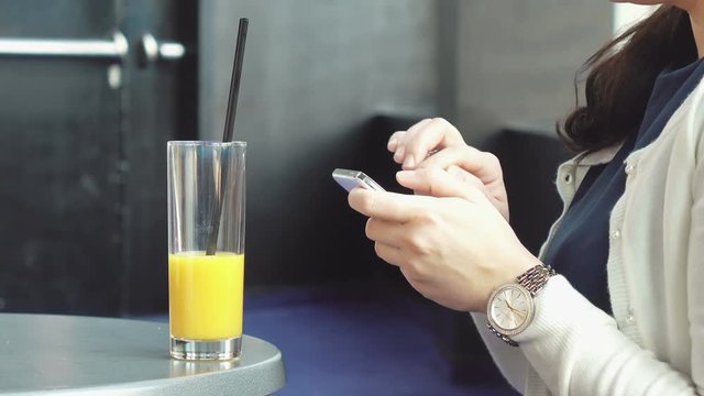High quality video of woman using phone in 4K