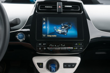 Hybrid car interior with infotainment system. Dispplay with touchscreen function.