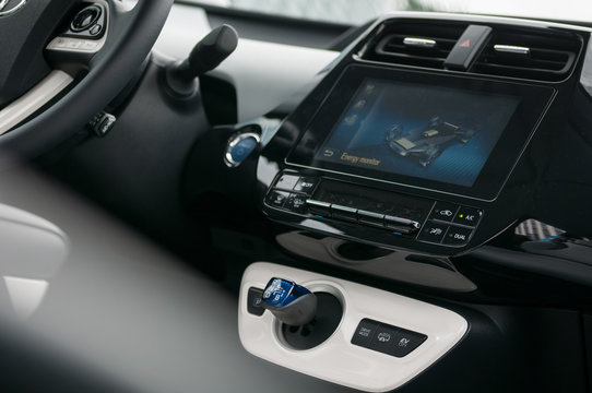 Hybrid car interior and energy monitor display.