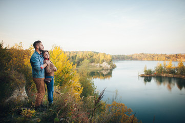 Naklejka premium Young happy couple enjoying together in wild mountain river.