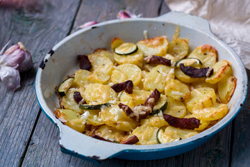 Potatoes baked with zucchini