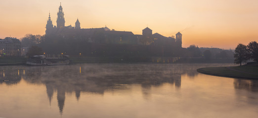 Fototapeta Panorama of Wawel Palace in foggy morning light in Krakow Poland obraz