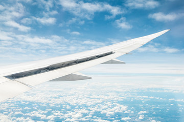 Fototapeta premium blue sky and white cloud view from windows of airplane for background - travel concept