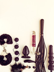 Different sex toys (dildo, prostate massager,  anal plug and beads, handcuffs, whip and others) on...