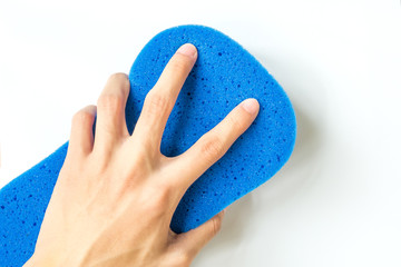 close-up of Hand holding blue Sponge for Car Wash on white background