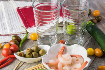 Ingredients of snack on skewers for alcohol blood mary cocktail.