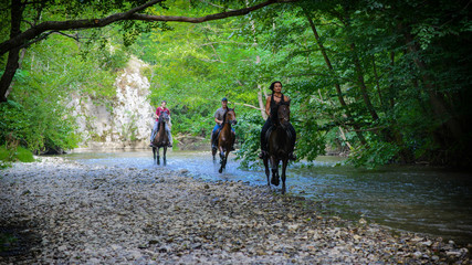 Obraz premium Horse riding on the river
