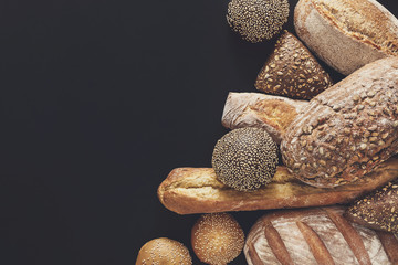 Bakery concept. Plenty of bread background isolated on balck