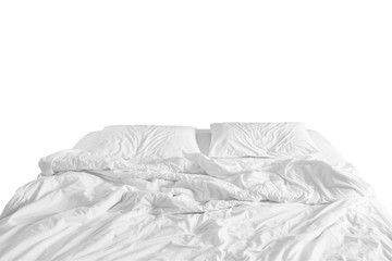 unmade bed with crumpled bed sheet, a blanket and pillows after comfort duvet sleep waking up in...