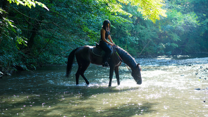 Horse riding on the river