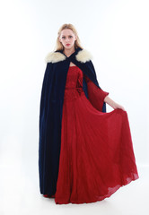 beautiful lady with long blonde hair wearing a red medieval fantasy gown. standing, isolated on white background.
