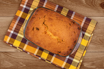 Delicious homemade cake on wooden background close-up, top view