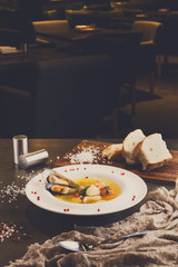 French seafood soup with white fish, shrimps and mussels in plat