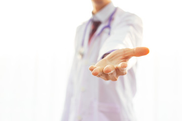 Physician or Doctor reaching hands out to help patients with copy space