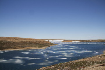 Summer colours in the high arctic with ice in the bay, Cambridge Bay Nunavut