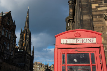Fototapeta na wymiar Red telephone cabin in the Royal Mile of Edinburg, Scotland