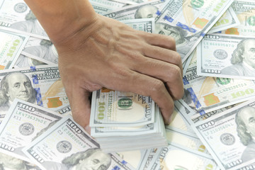 Hunger's hand is gaining big money. (Hunger for money concept)