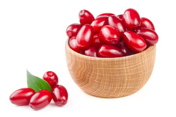 dogwood berry with leaf in a wooden bowl isolated on white background