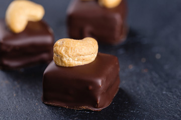 Handmade chocolate bonbons with cashew
