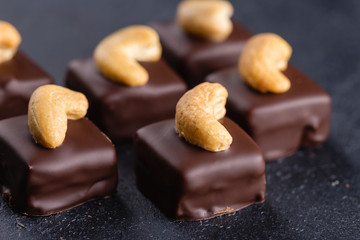 Handmade chocolate bonbons with cashew
