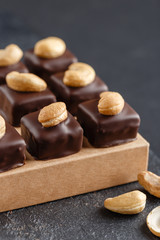 Handmade chocolate bonbons with cashew