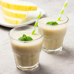 Summer refreshing drinks,melon banana smoothie. Selective focus, copy space.