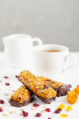 granola bars with dried fruits and honey in chocolate